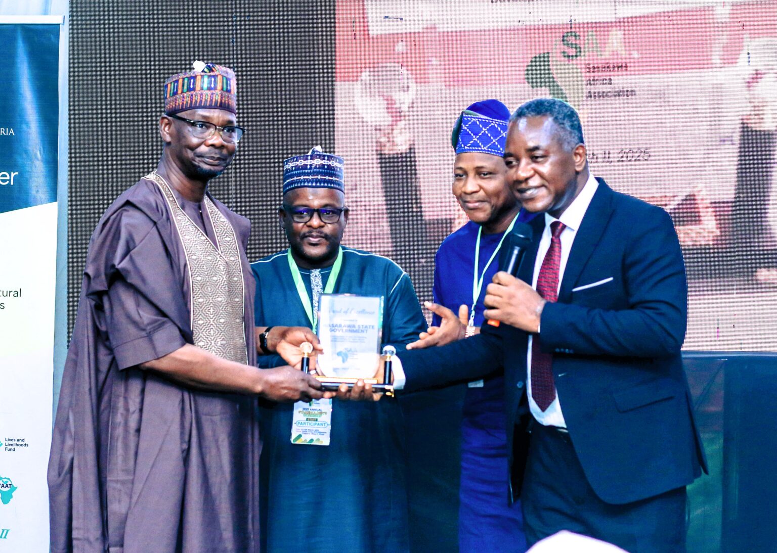 Governor Sule Echoes Partnership With Sasakawa For Agricultural Transformation In Nasarawa Governor Sule receiving the award from the Country Director, SAA Nigeria, Dr Godwin Atser.